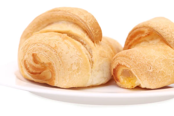 Croissants with vanilla cream. — Stock Photo, Image