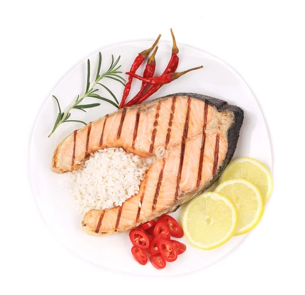 Grilled salmon steak with vegetables on plate. — Stock Photo, Image