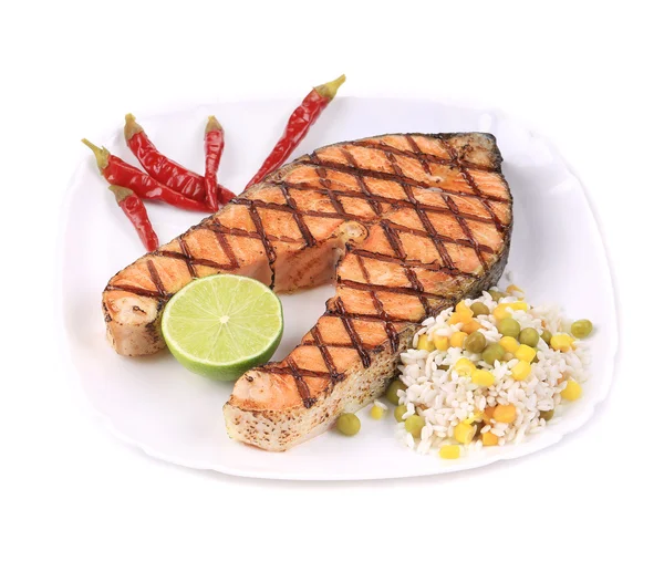 Grilled salmon steak with vegetables on plate. — Stock Photo, Image