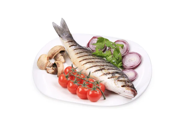 Grilled seabass on plate with tomatoes. — Stock Photo, Image