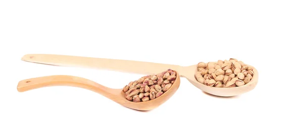 Wooden spoons of pistachios. — Stock Photo, Image