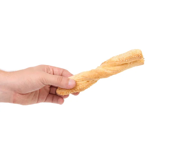 Hand holds cheese sticks with seeds. — Stock Photo, Image