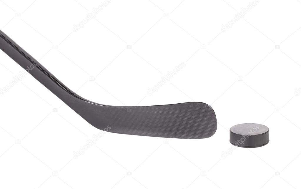 Black ice hockey stick and puck.