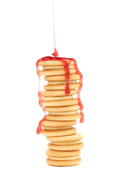 Stack of cookie biscuits in strawberry sauce. — Stock Photo, Image