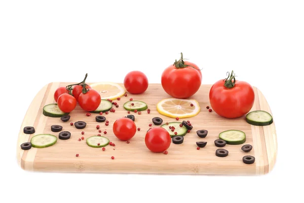 Vegetables and olives on cutting board. — Stock Photo, Image