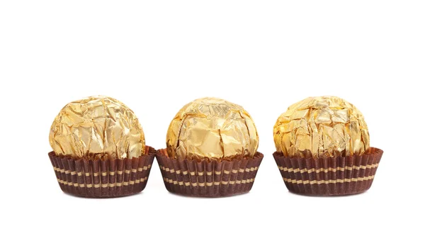 Three in row chocolate bonbons. — Stock Photo, Image