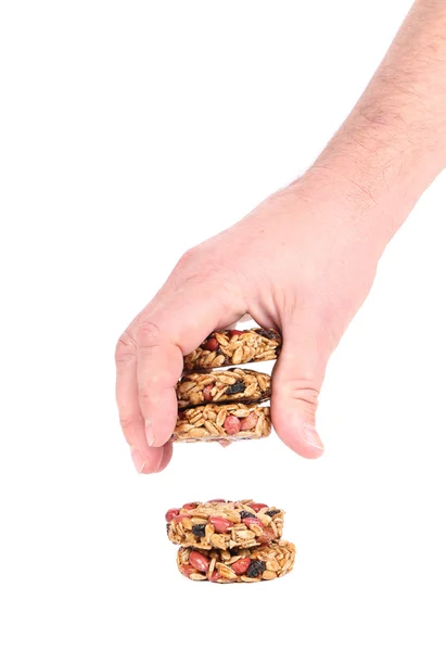 Hand holds candied peanuts sunflower seeds. — Stock Photo, Image