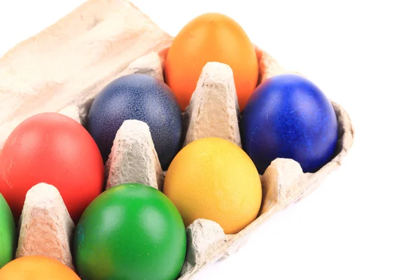 Cardboard box with Easter colored eggs. — Stock Photo, Image