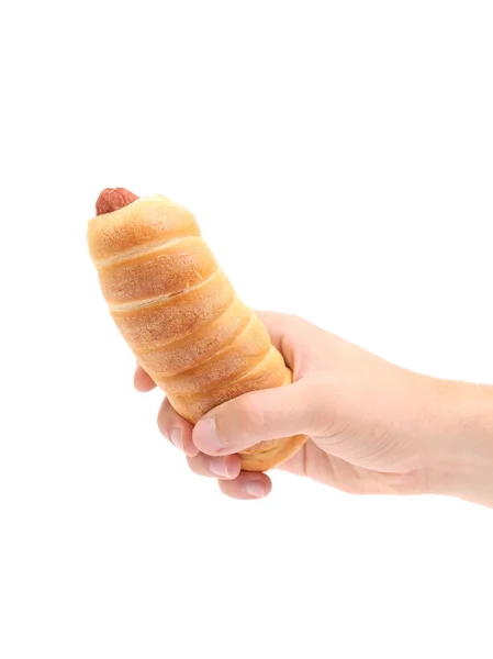 Hand hält Hot Dog gebacken. — Stockfoto