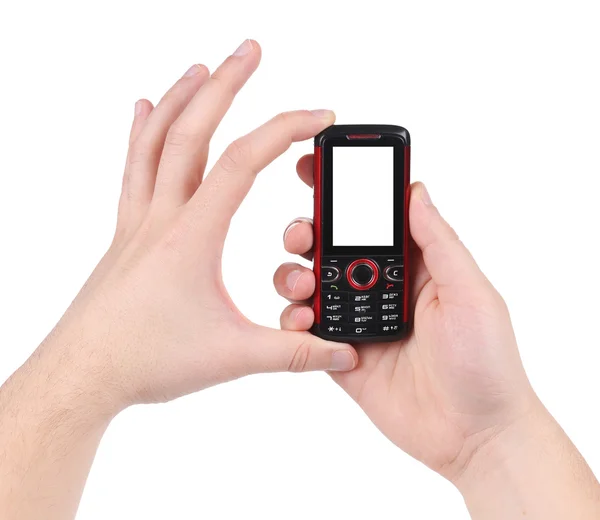Рука тримає червоно-чорний мобільний телефон . — стокове фото