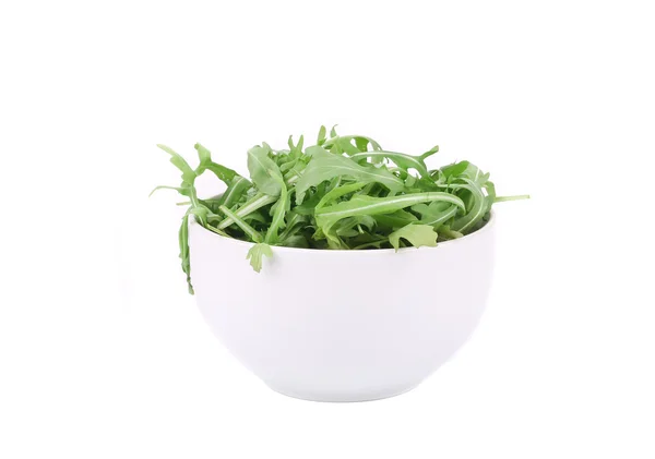 Fresh arugula in white bowl. — Stock Photo, Image