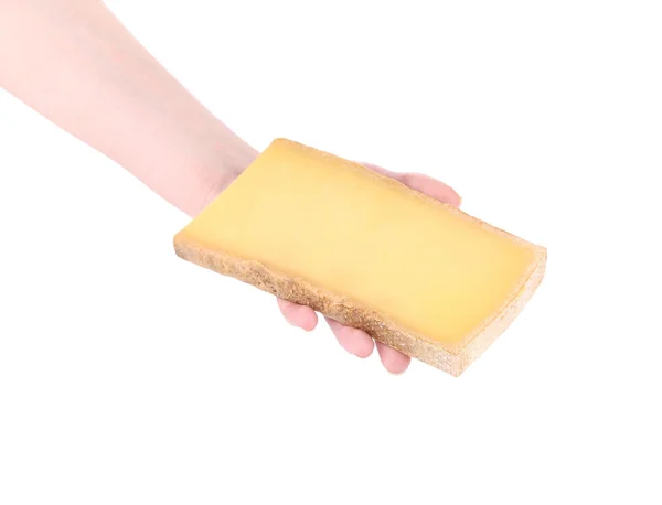 Piece of cheese in a man's hand. — Stock Photo, Image