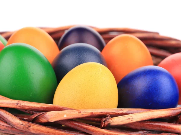 Colorful easter eggs in basket. — Stock Photo, Image