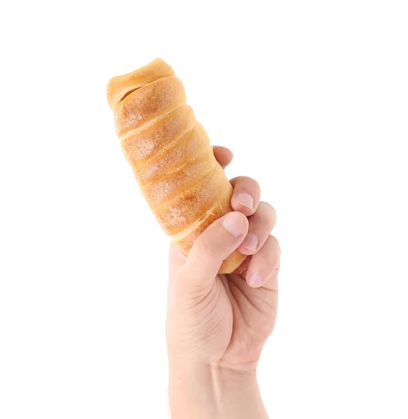 Ręka trzyma pieczone hot dog. — Zdjęcie stockowe