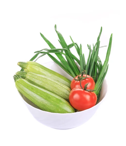Bowl with marrows and tomatoes. — Stock Photo, Image