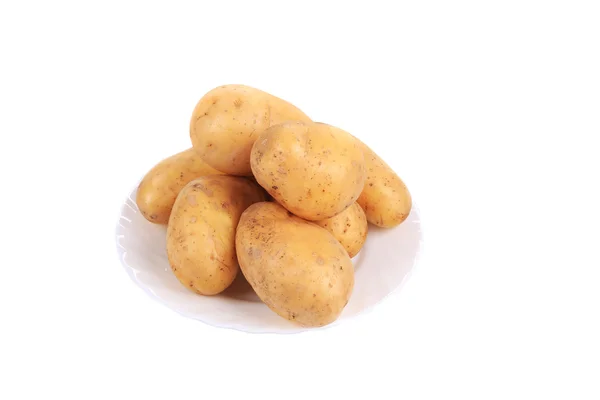 Batatas maduras no prato . — Fotografia de Stock