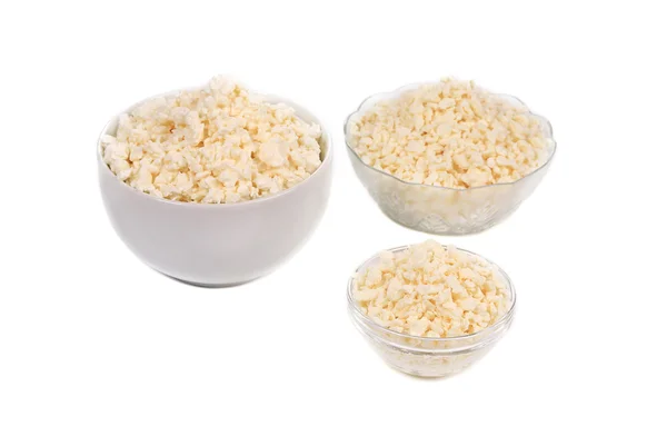 Cottage cheese in various bowls. — Stock Photo, Image