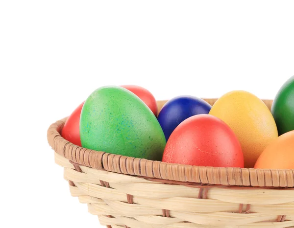 Easter eggs on wicker basket. — Stock Photo, Image