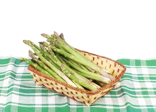 Wicker basket full with asparagus. — Stock Photo, Image