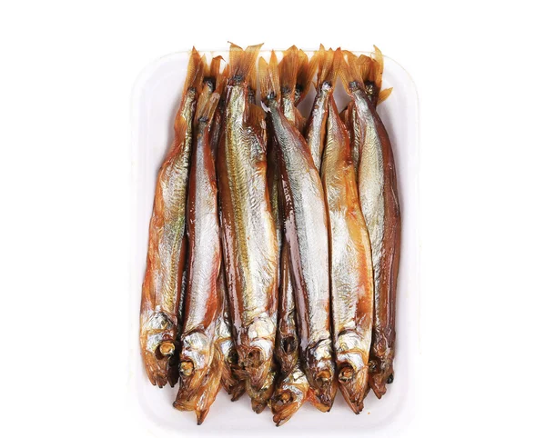 Peixe fumado em um prato . — Fotografia de Stock