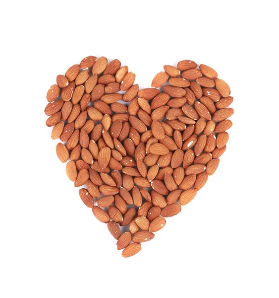 Almonds nuts in heart shape. — Stock Photo, Image