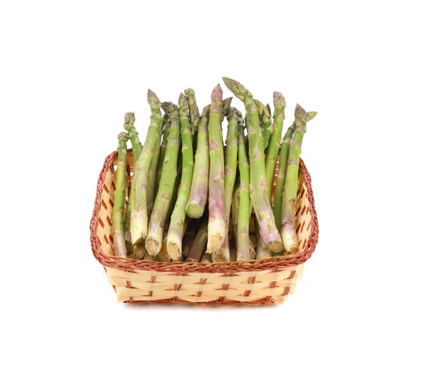 Wicker basket full with asparagus. — Stock Photo, Image
