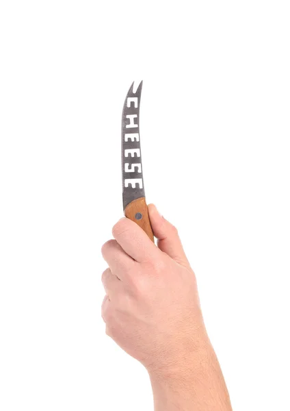 Hand holds cheese knife. — Stock Photo, Image