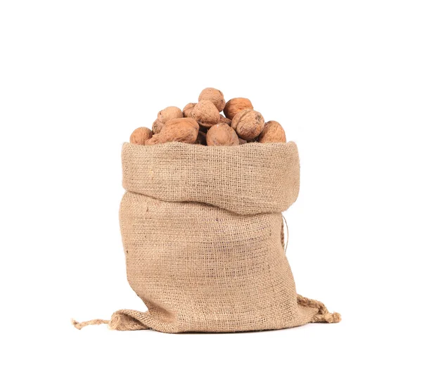Burlap bag with walnuts. — Stock Photo, Image