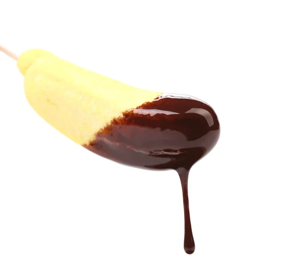 Skumfidus i chokoladesirup . - Stock-foto