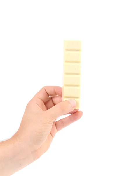 Hand holds white chocolate bar with filling. — Stock Photo, Image