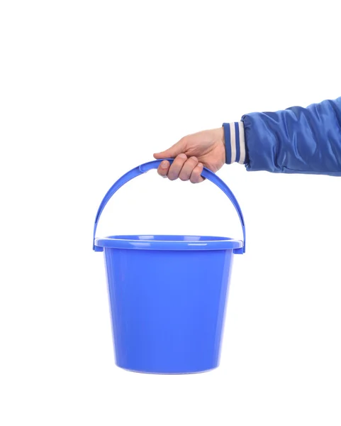 Hand holding blue bucket. — Stock Photo, Image