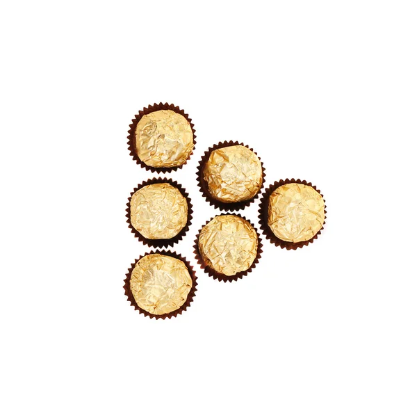 Triangle of golden bonbons. — Stock Photo, Image