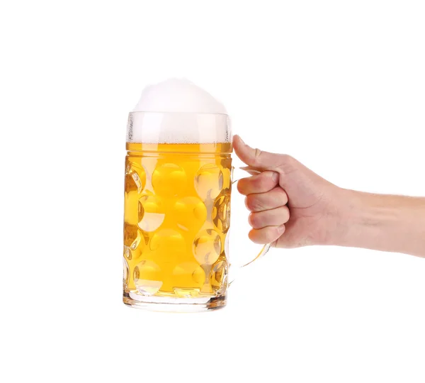 Mug of beer with foam in hand. — Stock Photo, Image