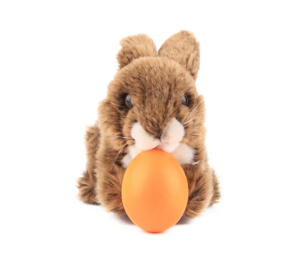 Easter rabbit and yellow egg. — Stock Photo, Image