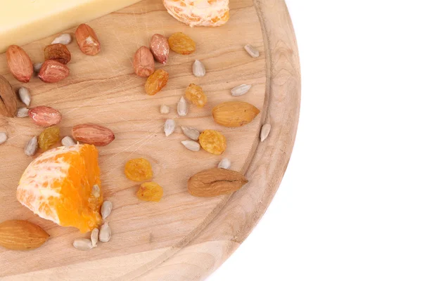 Cheese on board with nuts and orange. — Stockfoto