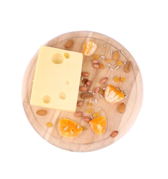 Cheese on board with nuts and orange. — Stock fotografie