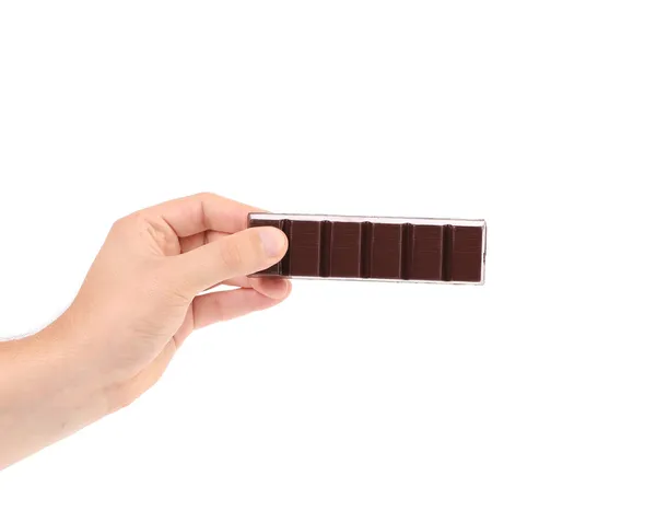 Mão segurando frustrado escuro chocolate bar . — Fotografia de Stock