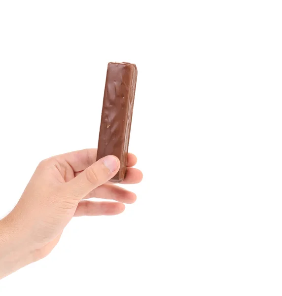 Hand houdt chocolade stok. — Stockfoto