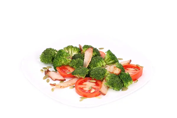 Broccoli salad with pumpkin seeds and tomatoes. — Stock Photo, Image