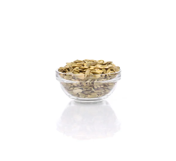Full glass bowl with pumpkin seeds. — Stock Photo, Image