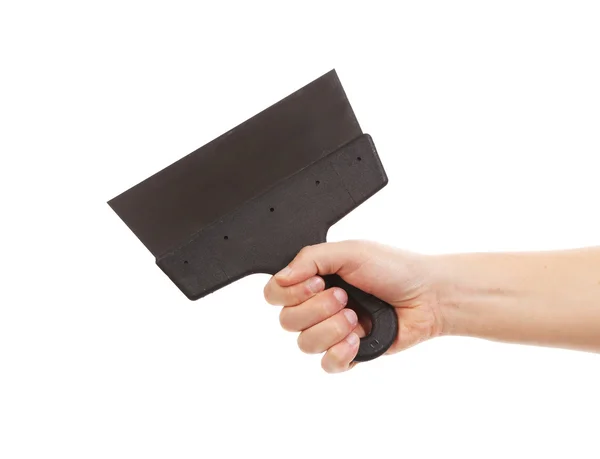 Hand holds construction spatula. — Stock Photo, Image