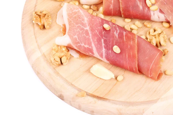 Composition of prosciutto on wooden platter. — Stock Photo, Image