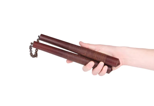 Hand holding nunchaku weapon. — Stock Photo, Image