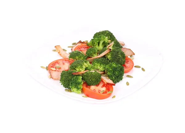 Broccoli salad with ham and pumpkin seeds. — Stock Photo, Image