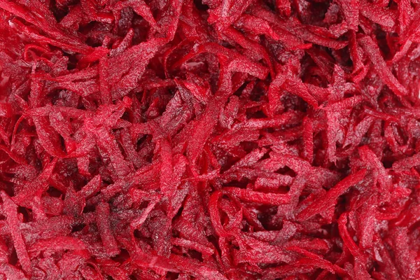 Closeup červené strouhané řepy jako pozadí. — Stock fotografie