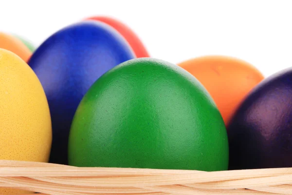 Colorful Easter eggs in basket. — Stock Photo, Image