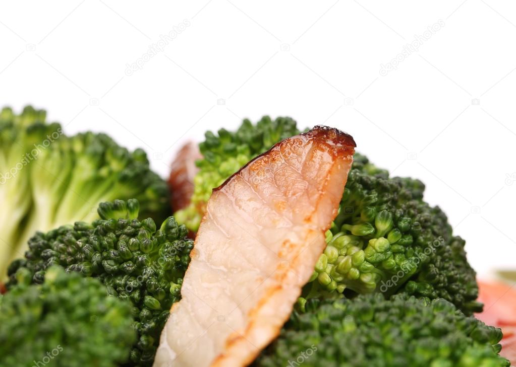 Closeup of fried ham and broccoli.