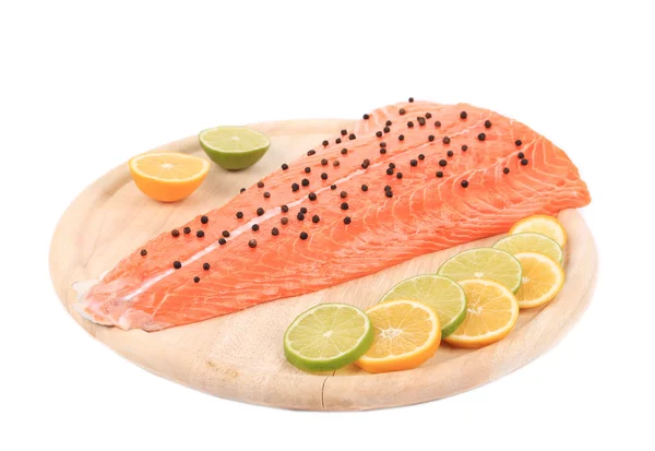 Raw salmon steak on cutting board. — Stock Photo, Image
