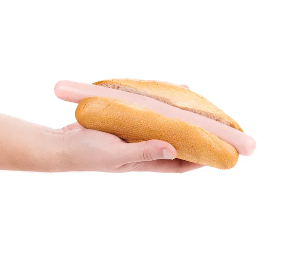 Mano tenendo gustoso hot dog . — Foto Stock