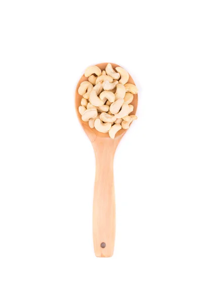 Salted cashew nuts on ladle. — Stock Photo, Image
